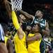 Michigan State and Michigan players reach for a rebound during the game on Sunday, Mar. 3. Daniel Brenner I AnnArbor.com
